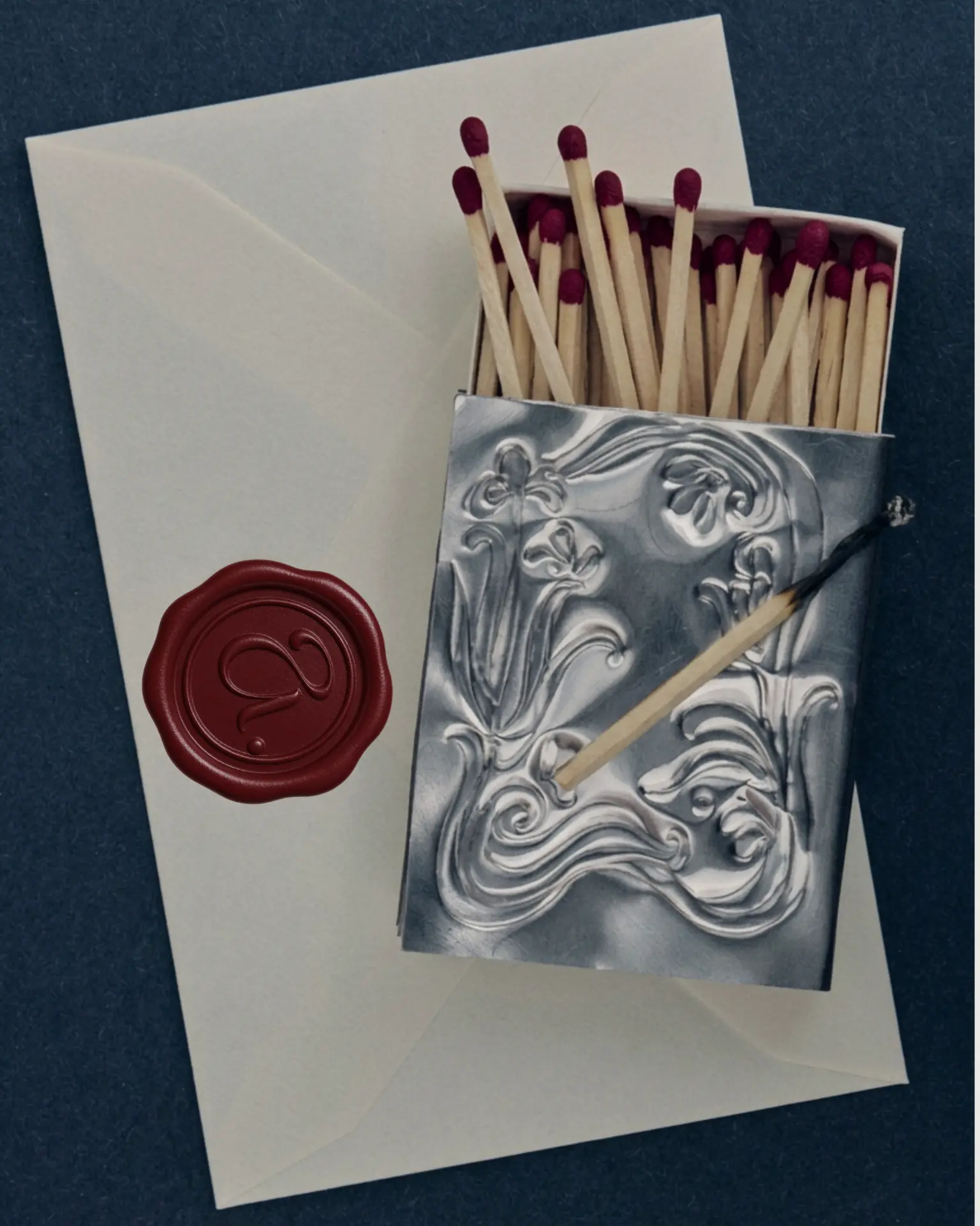 Wax-sealed envelope with an embossed matchbook